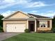 Charming brick home with a two-car garage, covered porch, and well-manicured lawn at 408 Oak View Ln, Dallas, GA 30157