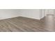 Spacious open floorplan living room with sleek wood-style flooring at 408 Oak View Ln, Dallas, GA 30157