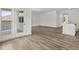 Bright living area with wood-look flooring and doors leading to the patio or backyard at 408 Oak View Ln, Dallas, GA 30157