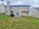 Large backyard with a patio area, perfect for outdoor relaxation at 4925 Locherby Dr, Fairburn, GA 30213
