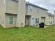 Spacious backyard with grass area and concrete patio at 4925 Locherby Dr, Fairburn, GA 30213