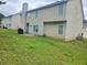 Backyard with grass area, patio, and residential landscape at 4925 Locherby Dr, Fairburn, GA 30213