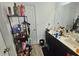 Bathroom featuring a dual sink vanity, mirror, and a door at 4925 Locherby Dr, Fairburn, GA 30213