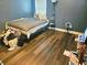 Cozy bedroom with wood floors, natural light, and a comfortable bed at 4925 Locherby Dr, Fairburn, GA 30213