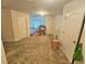 Upstairs bonus room area with neutral walls and carpet flooring at 4925 Locherby Dr, Fairburn, GA 30213