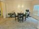 Dining room featuring crown molding, carpet, and a classic chandelier at 4925 Locherby Dr, Fairburn, GA 30213