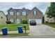 Two-story brick home with a well-maintained lawn and two-car garage at 4925 Locherby Dr, Fairburn, GA 30213