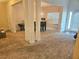 Neutral living room with decorative columns and abundant natural light at 4925 Locherby Dr, Fairburn, GA 30213