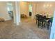 Open floor plan showing living room with adjacent dining and kitchen areas at 4925 Locherby Dr, Fairburn, GA 30213