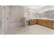 Elegant bathroom featuring a frameless glass shower and and vanities at 1609 Tielman Way, Snellville, GA 30078