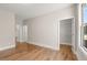 Bedroom with hardwood floors and doorway to the walk-in closet at 1609 Tielman Way, Snellville, GA 30078