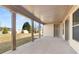 An inviting covered patio with sturdy columns and a view of the manicured lawn at 1609 Tielman Way, Snellville, GA 30078