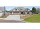 Charming brick home with three-car garage and well-maintained landscaping at 1609 Tielman Way, Snellville, GA 30078