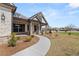 Charming home exterior featuring manicured landscaping, stone accents, and covered front porch at 1609 Tielman Way, Snellville, GA 30078