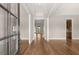 Grand foyer with hardwood floors, tray ceilings and views into the living room at 1609 Tielman Way, Snellville, GA 30078