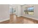 Bright living room with hardwood floors, large windows and an open floor plan for a spacious feel at 1609 Tielman Way, Snellville, GA 30078