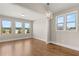 Open living room features hardwood floors, plenty of natural light, and neutral paint, creating a welcoming space at 1609 Tielman Way, Snellville, GA 30078