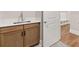 A sink and vanity are conveniently located in the mudroom near a built-in storage nook at 1609 Tielman Way, Snellville, GA 30078