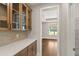 Convenient butler's pantry with custom cabinetry, ample counter space, and open shelving at 1609 Tielman Way, Snellville, GA 30078
