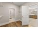 Walk-in closet features hardwood floors and doors to bathroom and laundry room at 1609 Tielman Way, Snellville, GA 30078