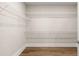 Walk-in closet features hardwood floors and modern shelving at 1609 Tielman Way, Snellville, GA 30078
