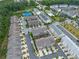 Community aerial view showcasing a mix of townhomes, pool, tennis court, and beautiful green spaces at 3 Hundley Ln, Roswell, GA 30076