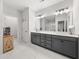 A modern bathroom vanity features gray cabinets and a marble countertop at 3 Hundley Ln, Roswell, GA 30076