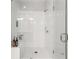 Modern bathroom featuring a glass-enclosed shower with white tile and built-in niche at 3 Hundley Ln, Roswell, GA 30076