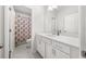 Clean bathroom with a shower-tub combination and bright white vanity at 3 Hundley Ln, Roswell, GA 30076