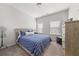 Cozy bedroom with a queen-sized bed, natural light, and neutral decor at 3 Hundley Ln, Roswell, GA 30076