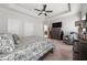 A spacious bedroom with tray ceilings and a ceiling fan at 3 Hundley Ln, Roswell, GA 30076