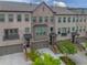 Charming townhome exterior with brick facade, inviting entrances, and well-maintained landscaping at 3 Hundley Ln, Roswell, GA 30076