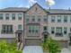 Charming townhome exteriors with brick facade, inviting entrances, and well-maintained landscaping at 3 Hundley Ln, Roswell, GA 30076
