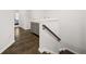A hallway with a wooden banister and base-molding detail leads into a bedroom at 3 Hundley Ln, Roswell, GA 30076