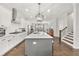 Modern kitchen with a large center island, stainless appliances and hardwood floors at 3 Hundley Ln, Roswell, GA 30076