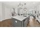 Bright, open kitchen featuring a large island with seating, modern appliances and fixtures at 3 Hundley Ln, Roswell, GA 30076