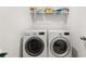 Efficient laundry area with modern, front-loading washer and dryer at 3 Hundley Ln, Roswell, GA 30076