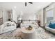 Open-concept living room with stylish decor, neutral color palette, and large windows at 3 Hundley Ln, Roswell, GA 30076