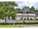 Restaurant exterior with ample parking, tasteful landscaping, and visible signage at 3 Hundley Ln, Roswell, GA 30076
