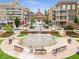 Town center featuring boutiques, a fountain, and manicured green spaces, creating a lively pedestrian environment at 3 Hundley Ln, Roswell, GA 30076