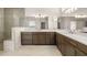 Spacious primary bathroom with a double vanity, stone countertops and a luxurious glass enclosed shower at 3772 Tielman St, Snellville, GA 30078