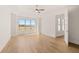 Bright bedroom featuring hardwood floors, a ceiling fan, and a large window with a scenic view at 3772 Tielman St, Snellville, GA 30078