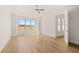 Bright bedroom with hardwood floors, ceiling fan, and large window with natural light at 3772 Tielman St, Snellville, GA 30078