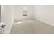 Bedroom with neutral carpet, a small window and white trim at 3772 Tielman St, Snellville, GA 30078