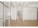 Bright foyer with hardwood floors and white trim, leading to an open floor plan beyond at 3772 Tielman St, Snellville, GA 30078