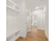 Hallway features hardwood floors, recessed lighting, and a built-in storage area with shelving and hooks at 3772 Tielman St, Snellville, GA 30078