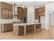 Well-appointed kitchen with stainless steel appliances, a center island, and plenty of storage at 3772 Tielman St, Snellville, GA 30078