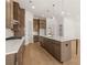 Gourmet kitchen featuring granite countertops, a large island, and plenty of storage space at 3772 Tielman St, Snellville, GA 30078