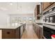 Spacious kitchen featuring a large center island, stainless steel appliances, and ample cabinet space at 3772 Tielman St, Snellville, GA 30078