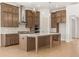 Modern kitchen with stainless steel appliances, large island, and stylish cabinetry at 3772 Tielman St, Snellville, GA 30078